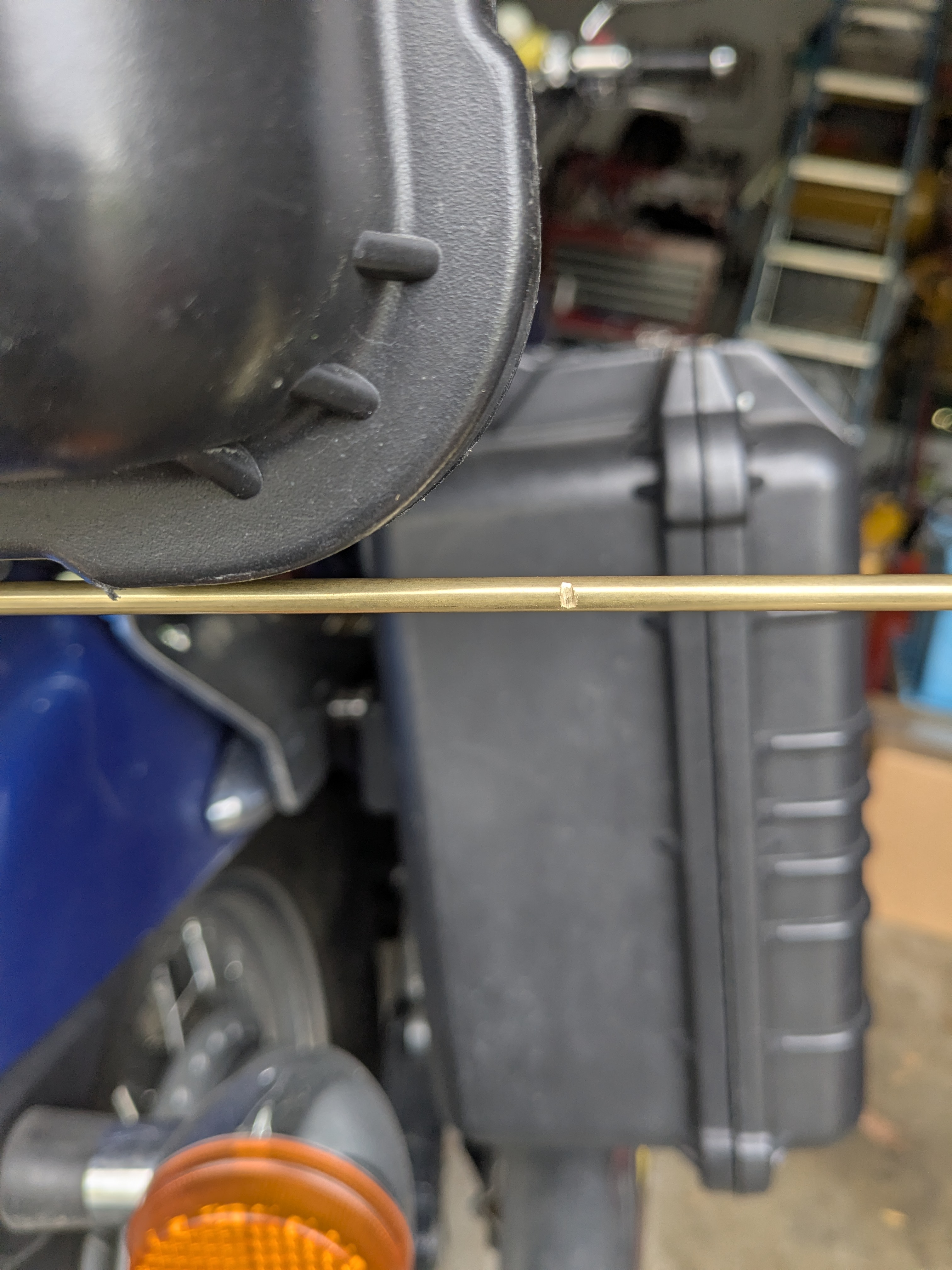 Brass tube cut to length and test-fit for the new hinge sleeve