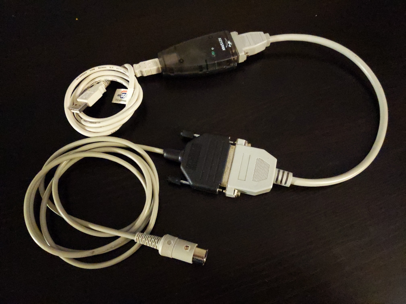 A large, awkward adapter chain used to connect the machine.